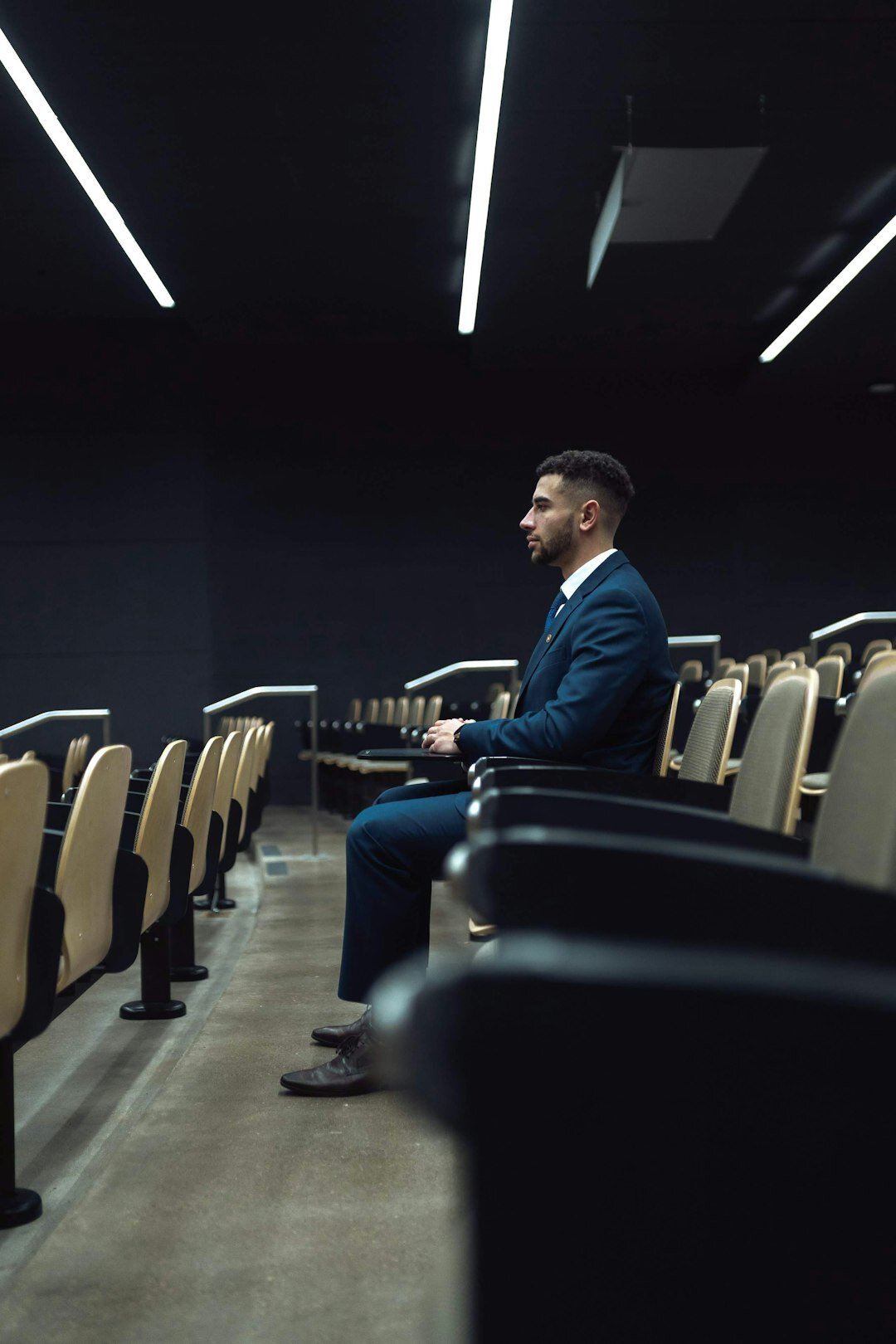 businessman playing piano on stage