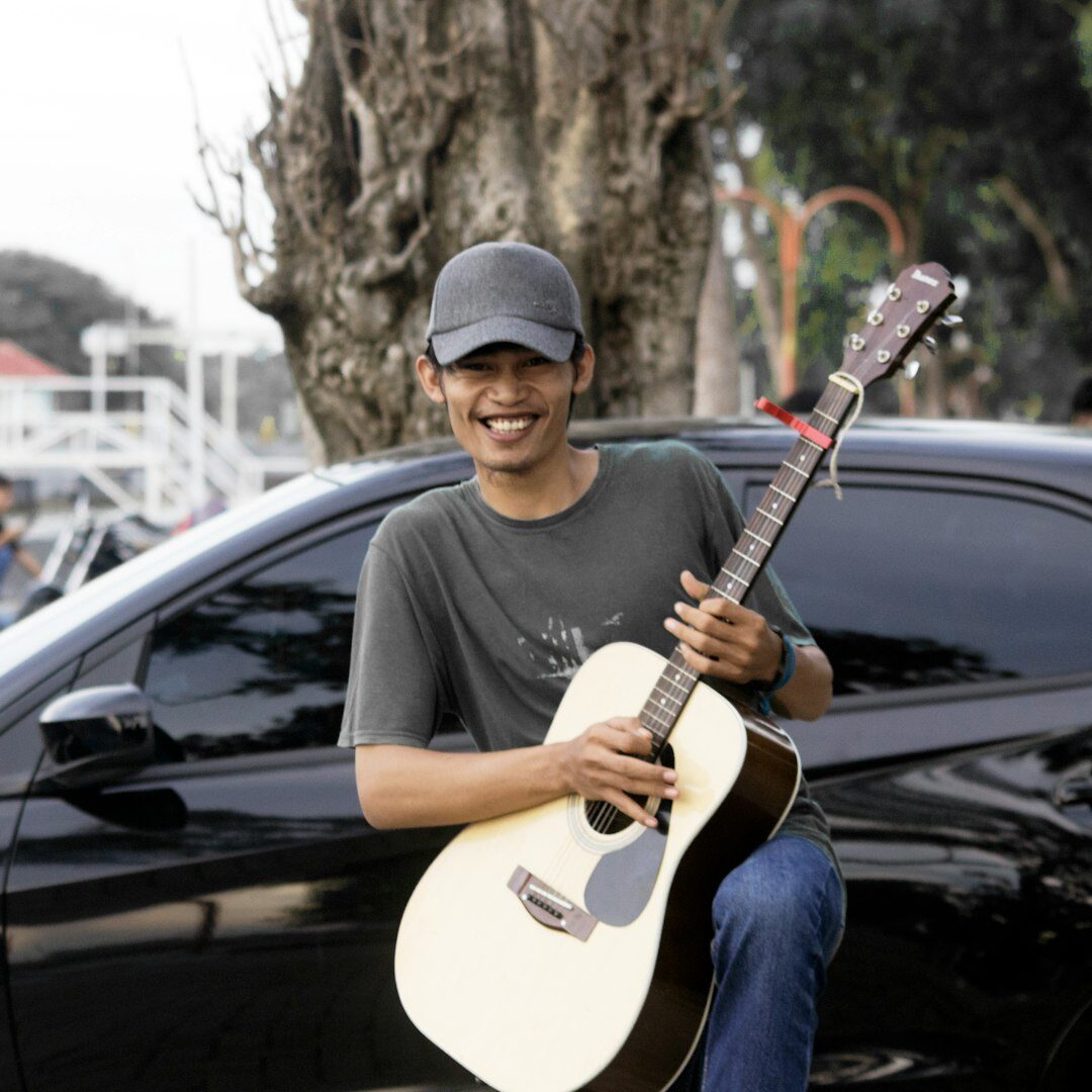 entrepreneur smiling with guitar