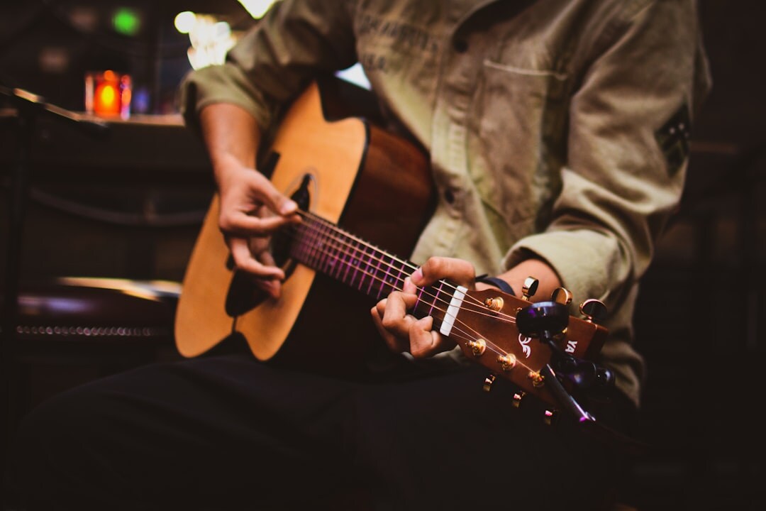 singer songwriter with guitar